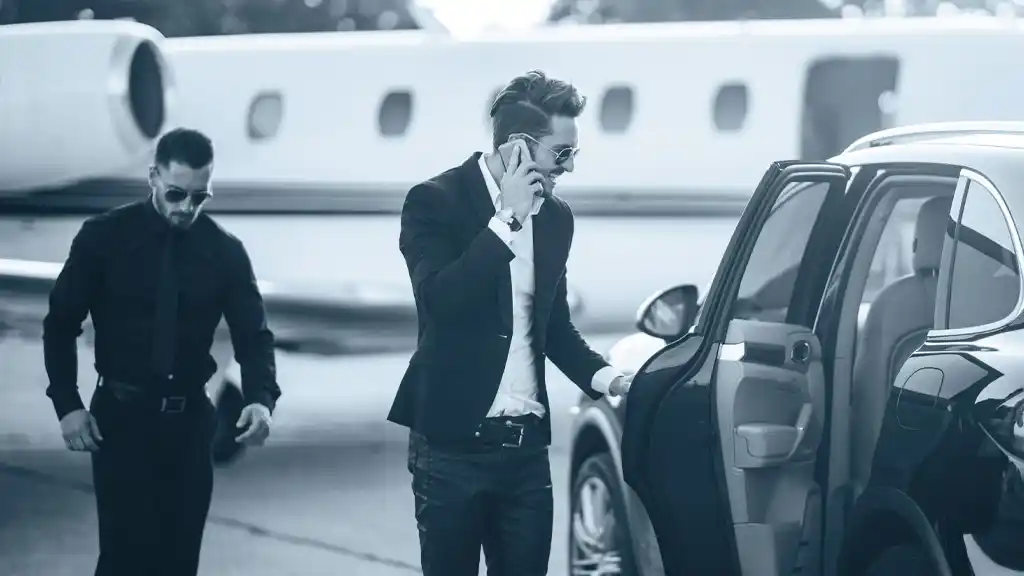 Celebrity at the airport exiting plane and getting into private car
